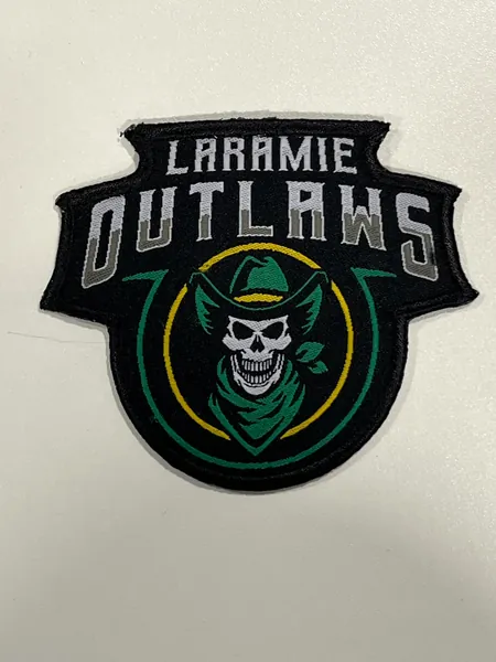 Laramie Outlaws woven patch with a cowboy skull in green and gold