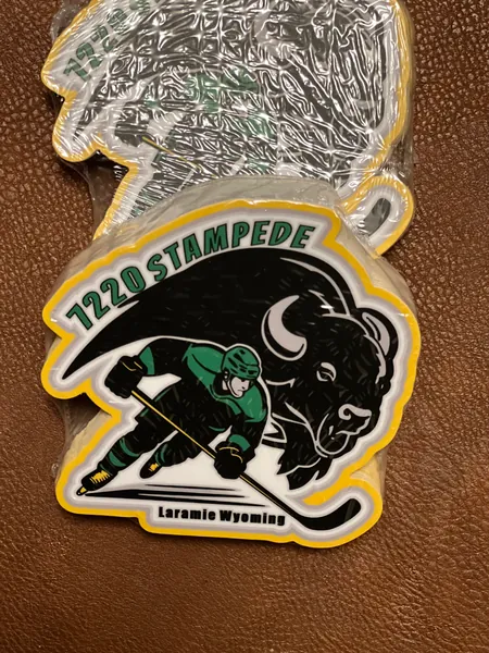 7220 Stampede patch with a hockey player and a bison, Laramie Wyoming