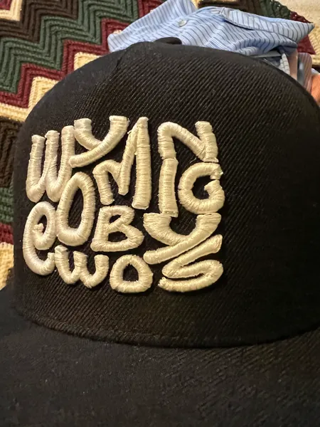 Black cap with Wyoming Cowboys in white raised embroidery